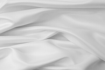 Rippled white silk fabric texture background
