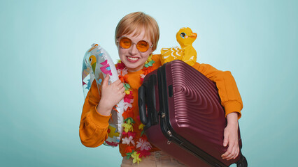 Traveler tourist young woman celebrating, dancing fooling with swimming inflatable duck toy....