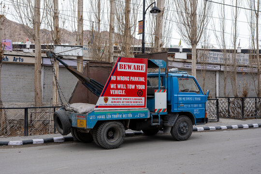 Leh, India - April 01, 2023: Side view of a tow truck parked in the streets