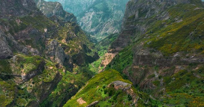 Pico do Areeiro, Madeira: Stunning aerial view of majestic mountain peak and mountain valley. Hikers, nomads, and sightseers embrace the captivating landscape.