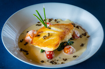 Chilean Sea Bass with Heirloom Tomatoes and Capers in a White Wine Garlic Sauce