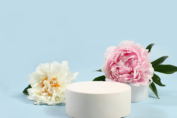 Minimal floral composition.Abstract background with empty podium and peonies flowers,empty showcase for display or presentation of cosmetic products