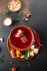 Ukraine food cuisine borsch on a dark background, vertical image. top view. place for text
