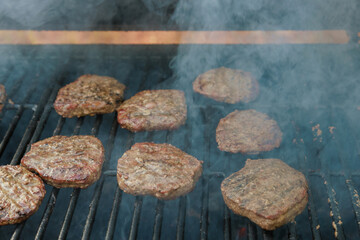 On bbq fire flame grill prepared cooked grilled beef meat barbecue burgers for hamburgers