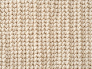 Light beige knitted sweater texture fabric as background 