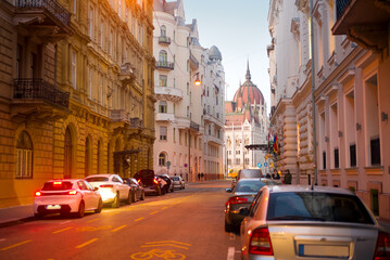 Fototapeta na wymiar Old street with Parliament dome view in Budapest