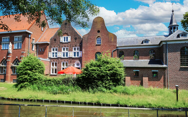 Beautiful red dutch brickhouses and medieval castle, water moat - Boxmeer (De Weijer), Netherlands