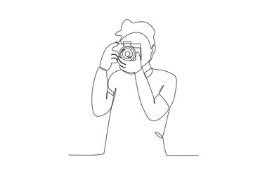 A boy take pictures of the scenery. World photography day one-line drawing