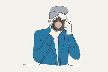 Color illustration of a cameraman taking a picture. World photography day one-line drawing