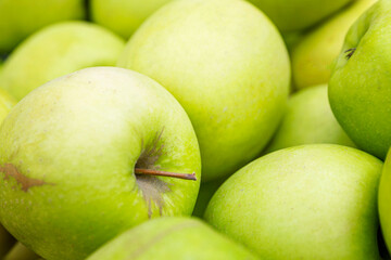 Lots of green apples. Health and vitamins. Close-up.