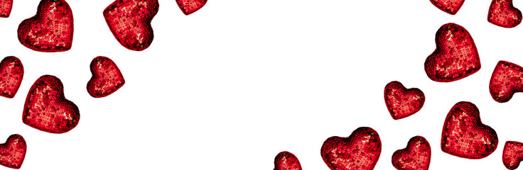 Christmas or Valentines composition made from glowing red heart decoration and glitter on pink...