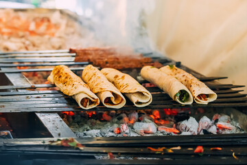 Cooking turkish fastfood - durum or doner - obrazy, fototapety, plakaty