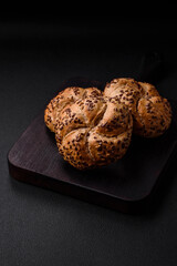Delicious freshly baked crispy bun or kaiser roll with sesame seeds