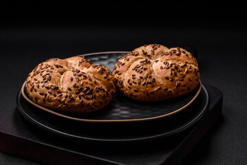 Delicious freshly baked crispy bun or kaiser roll with sesame seeds