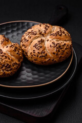 Delicious freshly baked crispy bun or kaiser roll with sesame seeds