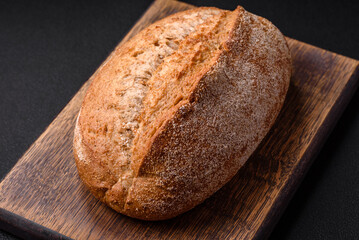 Delicious fresh baked crispy loaf of bread with seeds and grains