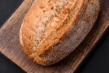 Delicious fresh baked crispy loaf of bread with seeds and grains