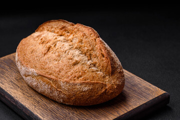 Delicious fresh baked crispy loaf of bread with seeds and grains