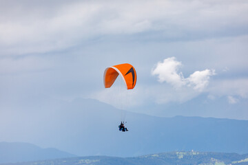 Paraglider in Dolomite mountains, Italy