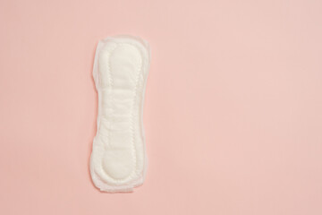 Feminine sanitary napkin (sanitary pad) on pink background - obrazy, fototapety, plakaty