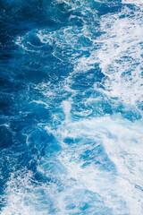 Fototapeta na wymiar Blue Water Cresting in Chaotic Ocean Background