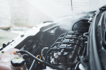 Man washing car engine