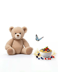 A beige teddy bear sits next to porridge in a bowl. Baby food advertisement. The concept of healthy food for children. Copy space for text, white background.