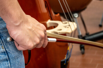 Real life young music students during rehearsals. Musical instruments and music stand with stave.