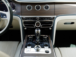 temperature, compass sensors and ventilation system in famous expensive premium car middle shot
