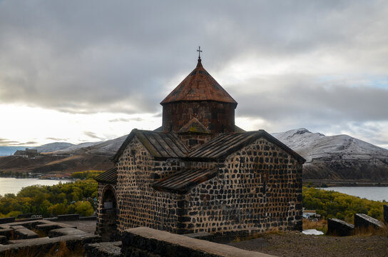 Sevanavank historic armenian orthodox Monastery complex above Sevan lake and snowy mountains on background. Armenia