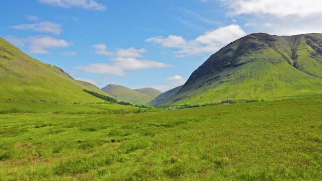Picturesque rolling Scottish highlands mountains on a sunny summer day, West Highland Way, Scotland