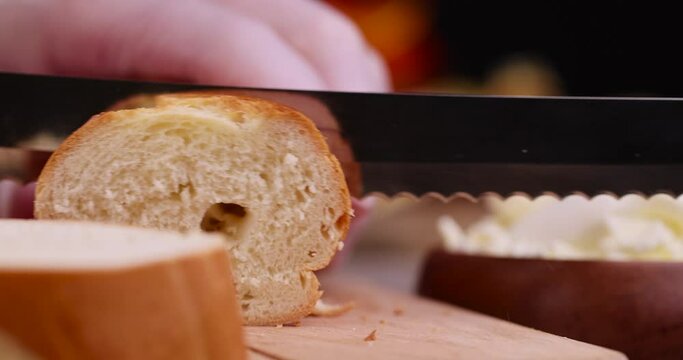 cut soft fresh long french bread in the kitchen, cooking using wheat baguette