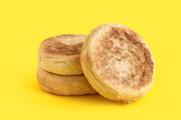 Bolo de caco. Traditional portuguese bread on yellow background
