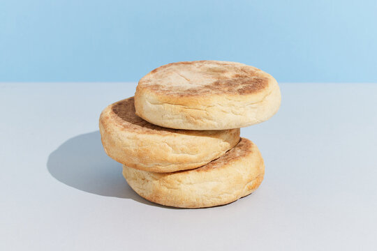 Bolo de caco. Traditional portuguese bread on blue creative background in minimal style