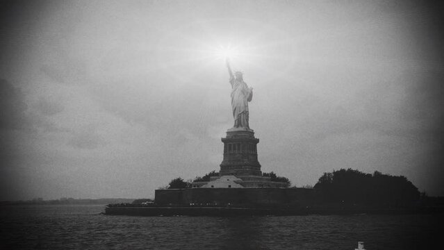 Old film style nostalgic statue of liberty with glowing torch