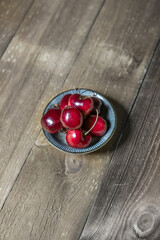 Lonely small saucer with delicious ripe cherries