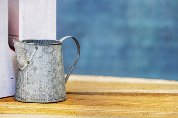 A pewter metal pitcher