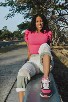 Beautiful afro hispanic girl having fun in the park Lifestyle. Concept of people and happiness.
