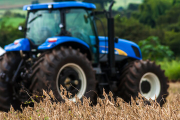 Sao Paulo state, Brazil, May 01, 2008. Blue tractor stopped on the mechanized soybean harvest on a farm in Brazil