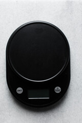 top view of a black kitchen scale , Digital kitchen scale for weighing food, scale for food...