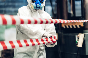 Scientist wear Chemical protection suit check danger chemical, working at dangerous zone in Red and...