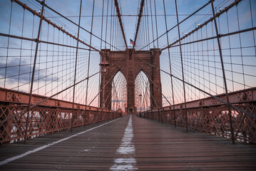 Naklejka na ściany i meble New York City skyline at sunset with Brooklyn Bridge and Lower Manhattan 