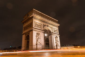 Fototapeta na wymiar Arc de Triomphe at Champs-Élysées in Paris at night