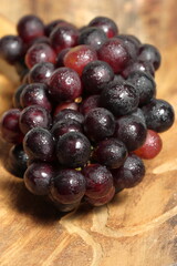 Black grapes on texture background