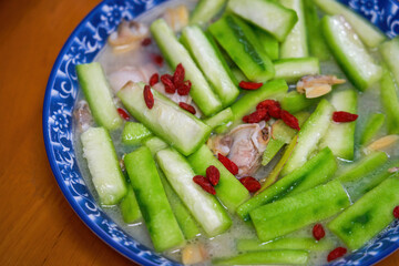 A delicious home-cooked dish with clams and snail melon in soup