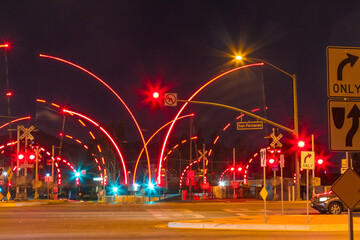 Railroad crossing during the night with motion gates