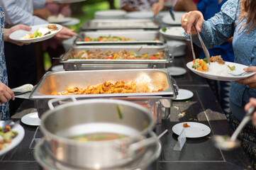 scooping the food, catering, dinner time