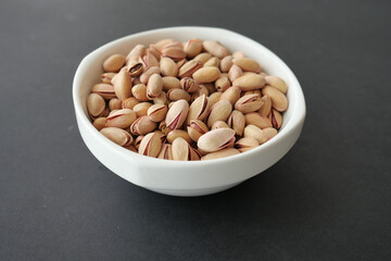 detail shot of pistachios nut on in bowl 