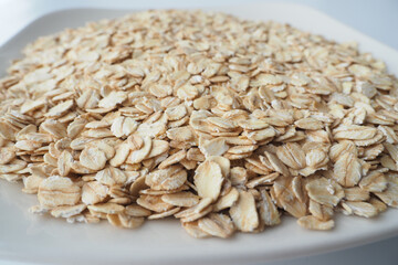 roasted oats flakes on a white plate 
