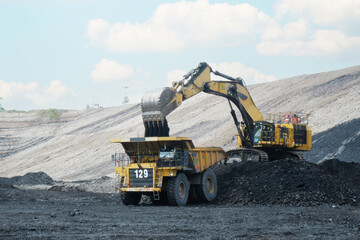 coal loading from excavator into truck, coal mine industry